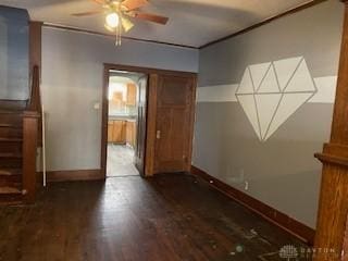 unfurnished room featuring dark wood-type flooring, baseboards, ornamental molding, and ceiling fan