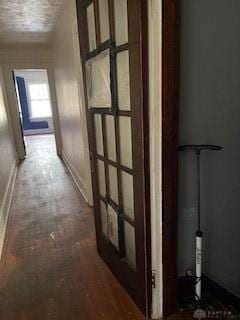 corridor with dark hardwood / wood-style floors