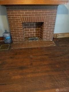 room details with a fireplace and hardwood / wood-style floors