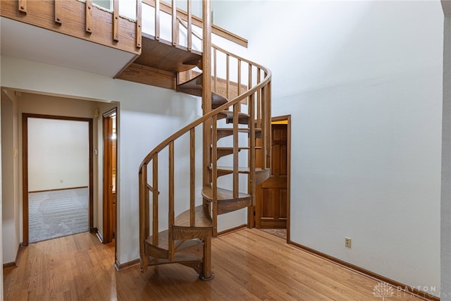 stairway featuring hardwood / wood-style flooring