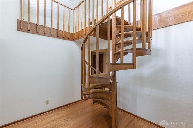 staircase featuring hardwood / wood-style flooring