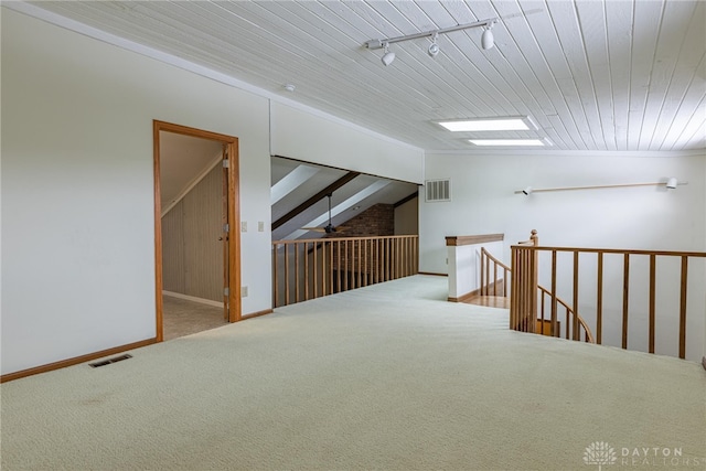 interior space featuring carpet floors and wood ceiling