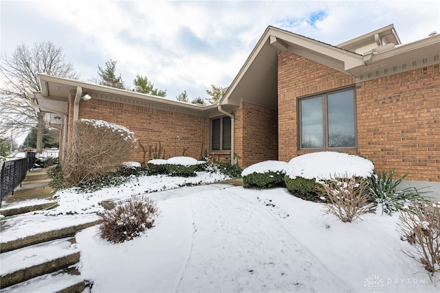 view of snow covered property