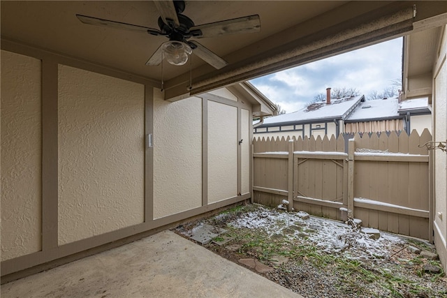 exterior space featuring ceiling fan