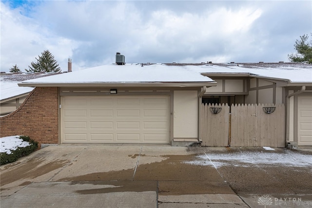 view of snow covered garage