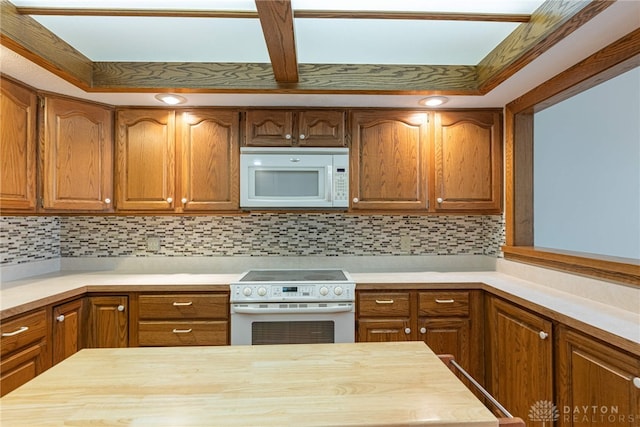 kitchen featuring wood counters, stove, and backsplash