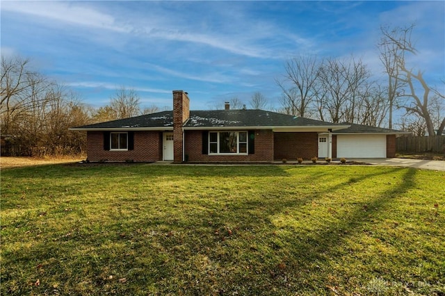 ranch-style home with a front yard and a garage