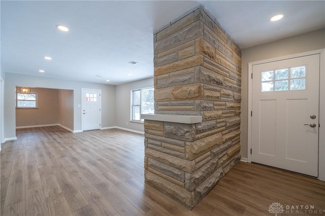 foyer entrance with hardwood / wood-style flooring