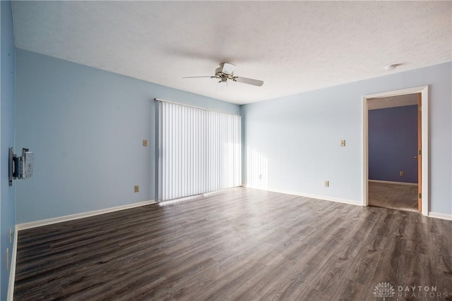 unfurnished room featuring a textured ceiling, ceiling fan, and dark hardwood / wood-style floors