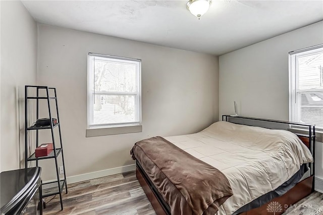 bedroom with hardwood / wood-style floors