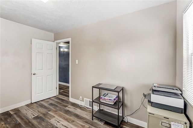 misc room with dark hardwood / wood-style flooring and a wealth of natural light