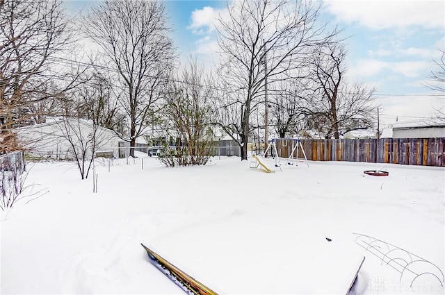 view of yard covered in snow