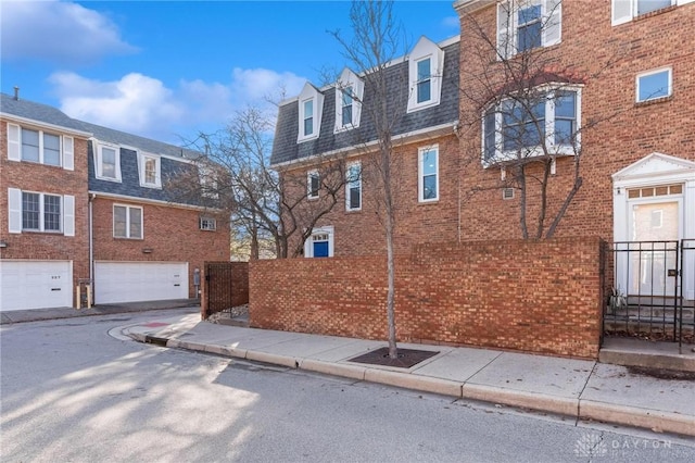 view of property exterior with a garage