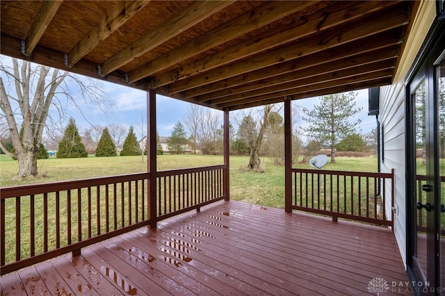 wooden terrace with a yard