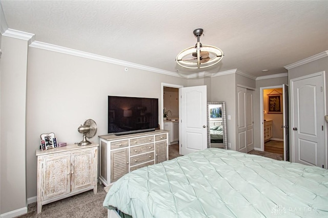 bedroom with carpet flooring, connected bathroom, sink, a closet, and ornamental molding