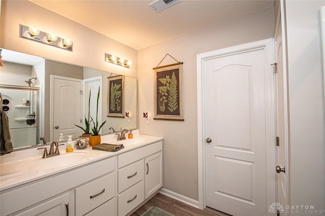 bathroom with hardwood / wood-style flooring and vanity