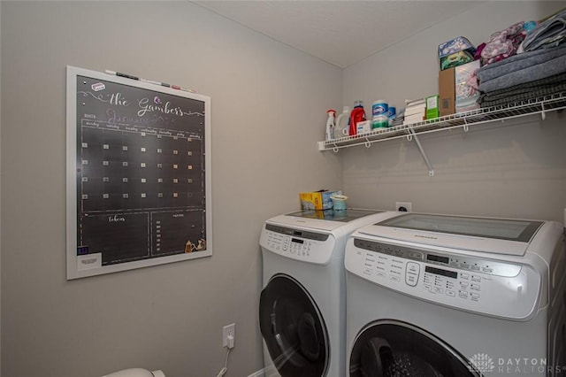 laundry area with separate washer and dryer