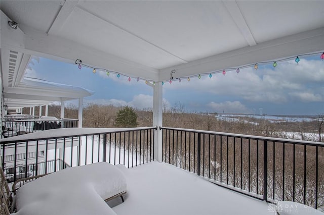 view of snow covered deck