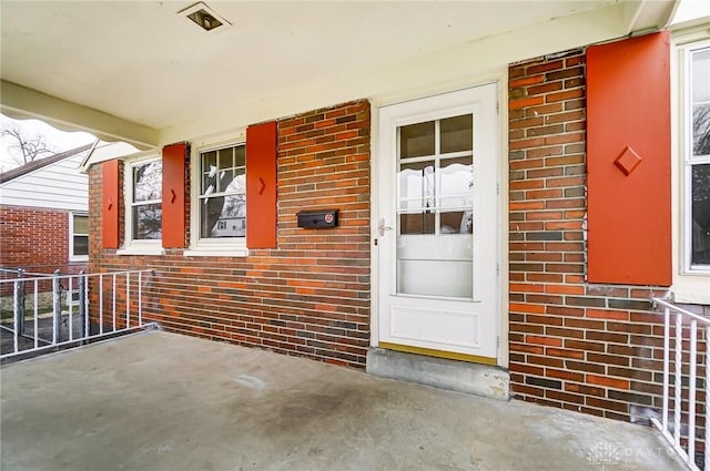 entrance to property with a porch