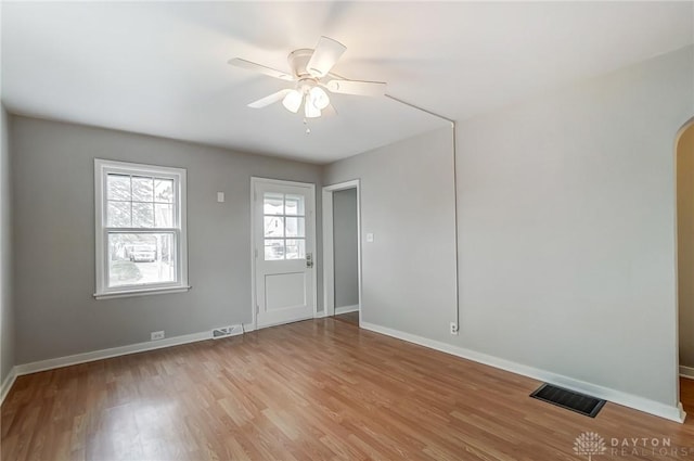 spare room with ceiling fan and light hardwood / wood-style flooring