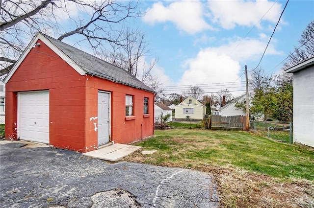 garage featuring a yard