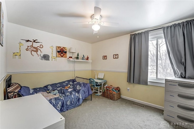 bedroom featuring light colored carpet and ceiling fan