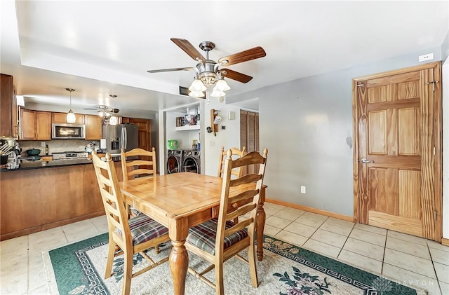 dining space featuring ceiling fan and light tile patterned flooring