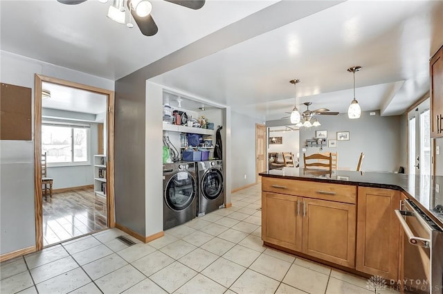 kitchen with light tile patterned flooring, separate washer and dryer, hanging light fixtures, ceiling fan, and built in shelves