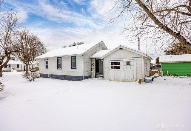 view of front of house with an outbuilding