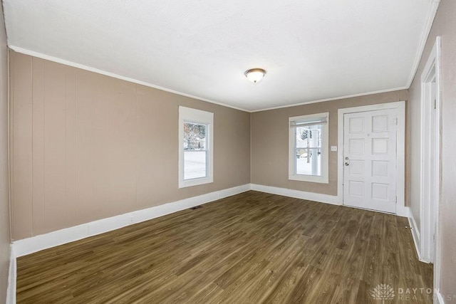 entryway with crown molding and dark hardwood / wood-style floors