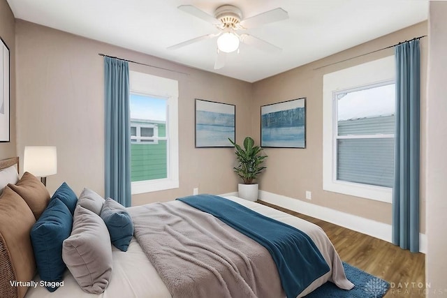 bedroom featuring hardwood / wood-style floors and ceiling fan