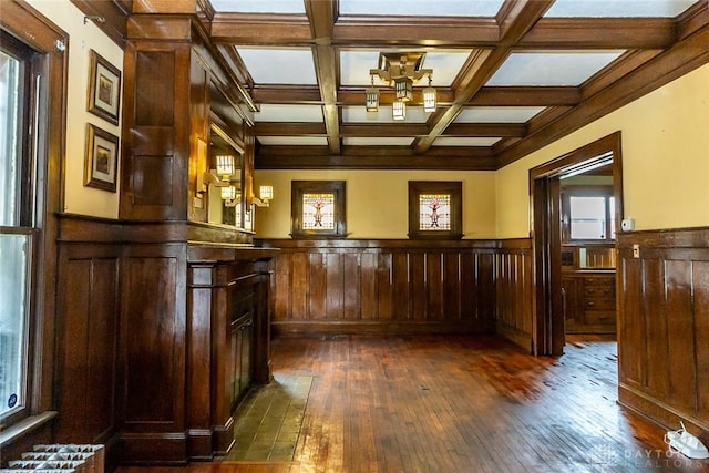 bar featuring wooden walls, beamed ceiling, dark hardwood / wood-style floors, and coffered ceiling