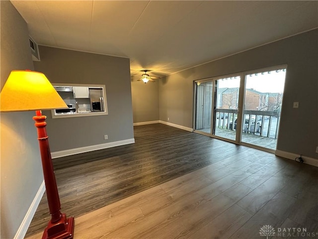 unfurnished living room with hardwood / wood-style flooring and ceiling fan