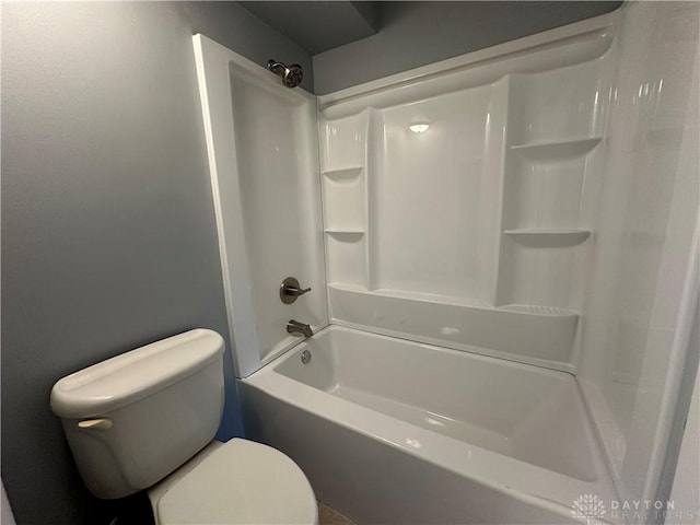 bathroom featuring toilet and shower / bathtub combination