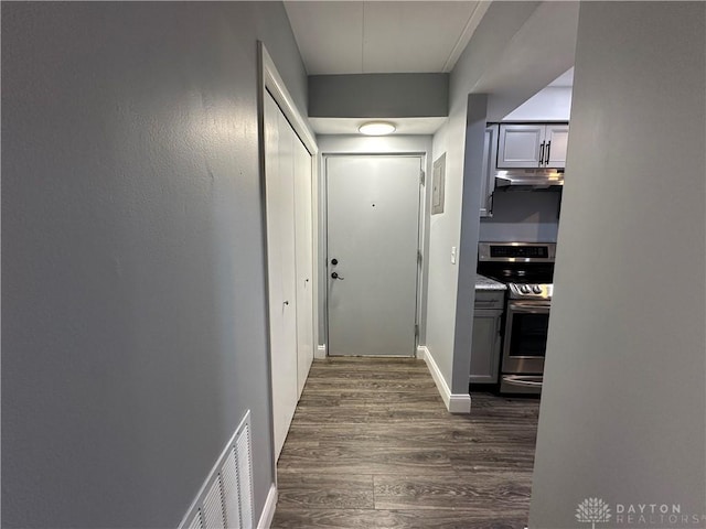 hall with dark hardwood / wood-style floors