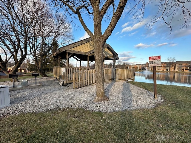 view of yard featuring a gazebo and a water view