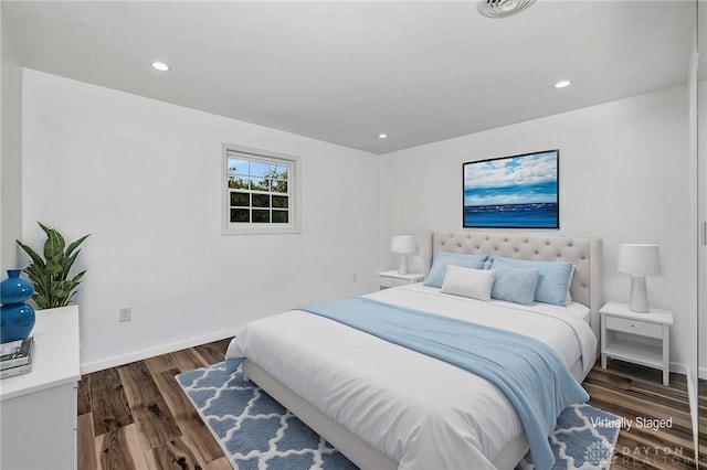 bedroom featuring dark hardwood / wood-style flooring