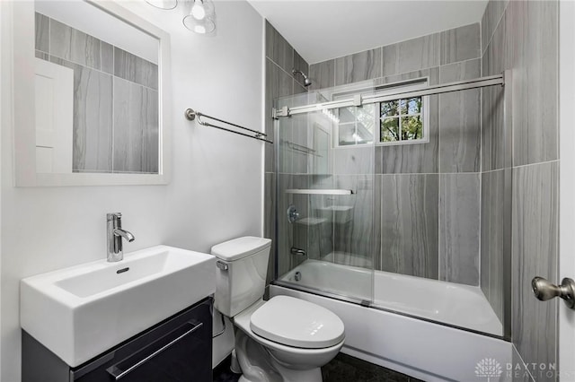 full bathroom with vanity, toilet, and enclosed tub / shower combo