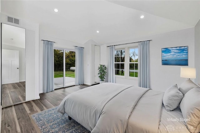 bedroom with access to exterior, lofted ceiling, multiple windows, and light hardwood / wood-style flooring