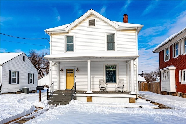 front facade featuring central AC unit