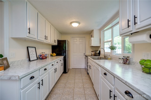 kitchen featuring a sink, dishwasher, white cabinets, and range with electric cooktop