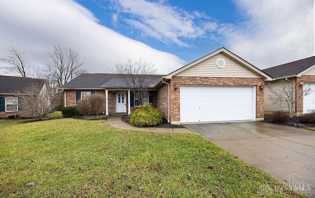 ranch-style home featuring a garage and a front yard