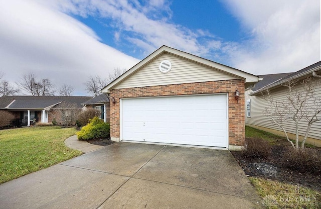 garage featuring a lawn