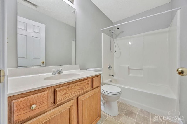 full bathroom with vanity, shower / bathtub combination, toilet, and a textured ceiling