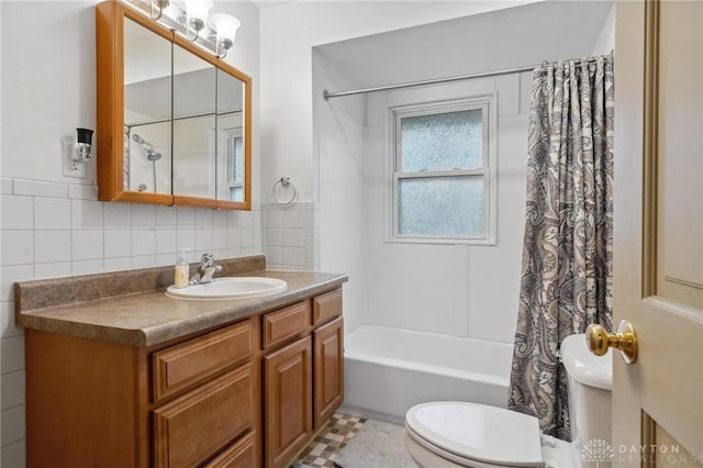 full bathroom featuring vanity, shower / bath combination with curtain, tile walls, and toilet