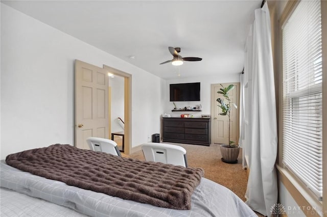 bedroom featuring ceiling fan and light colored carpet