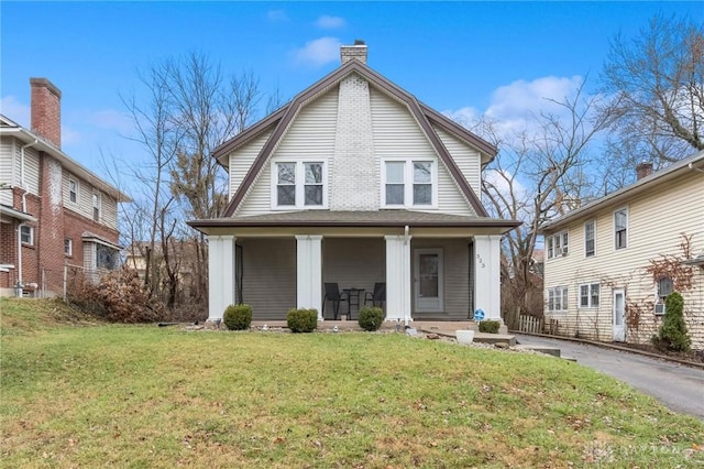 view of front of home featuring a porch and a front lawn