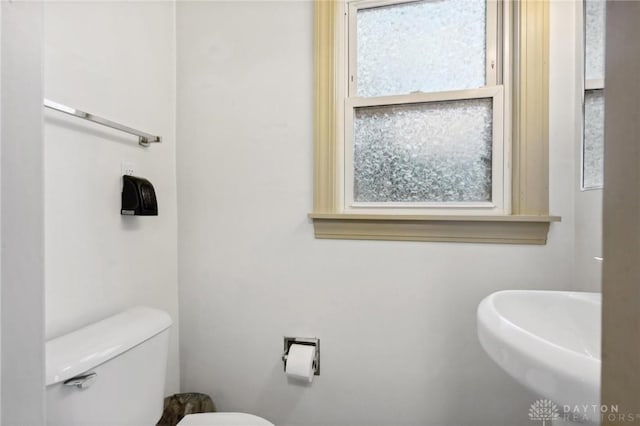 bathroom featuring toilet and sink