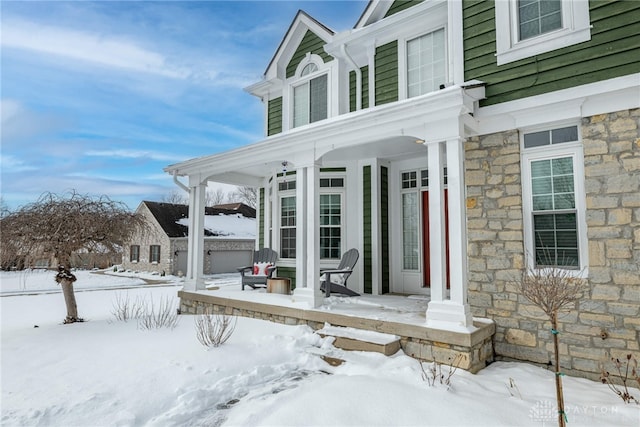 view of snow covered property entrance