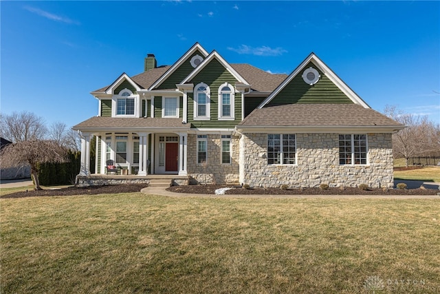 view of front of house featuring a porch and a front yard